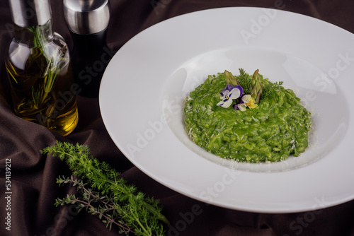 Dish of risotto with asparagus closeup