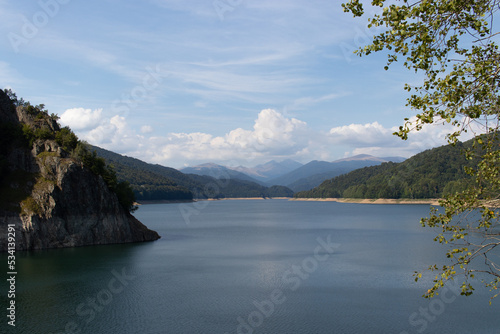 Vidraru lake in the mountains. Panoramic mountain landscape scene 