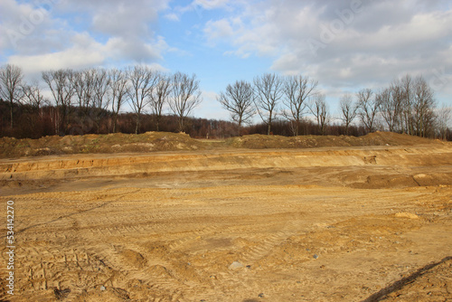 Fototapeta Naklejka Na Ścianę i Meble -  KRAKOW, POLAND - JANUARY 16, 2014: Land prepared by bulldozers for a new investment.
