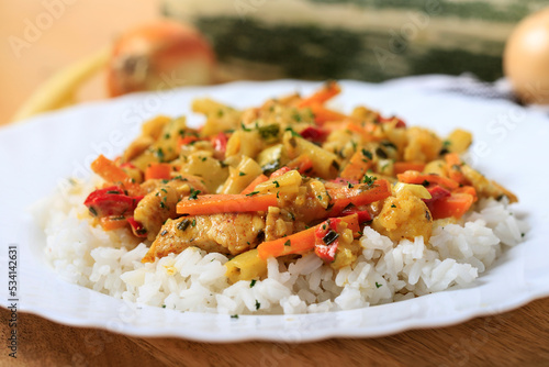 Chicken with vegetables and rice.