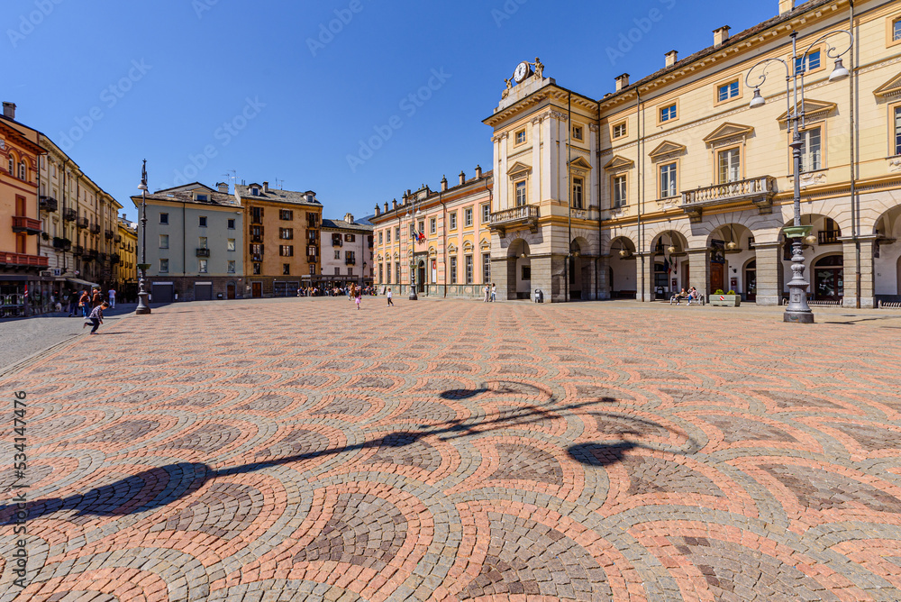 Aosta, Italy. View of Piazza Émile Chanoux with on the right the facade of the building which houses the Town Hall of the city. April 17, 2022.