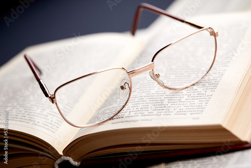 glasses on the book pages