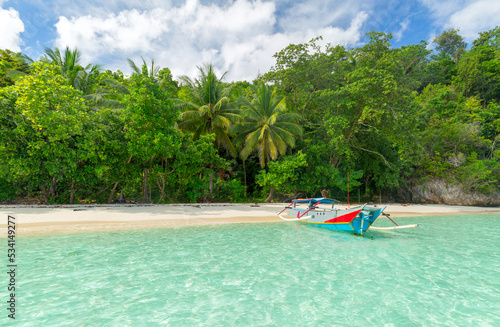 Traditional wooden fishing boats and beautiful Indonesian beach. Beautiful indonesian beach