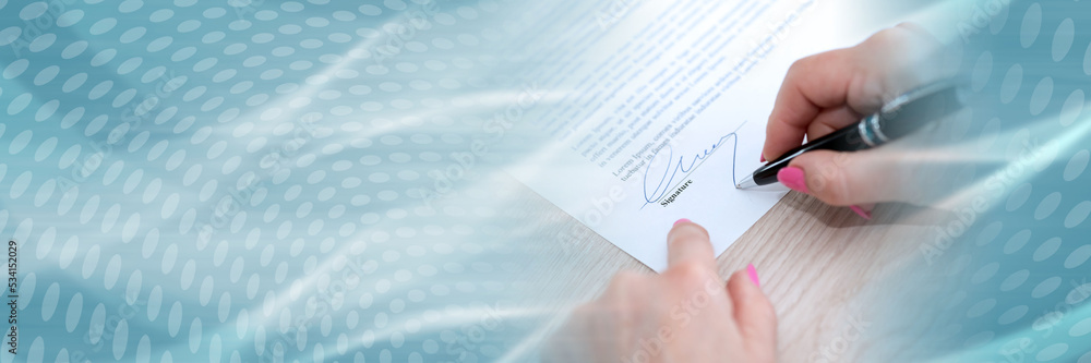 Woman signing a contract; panoramic banner Woman signing a contract; panoramic banner