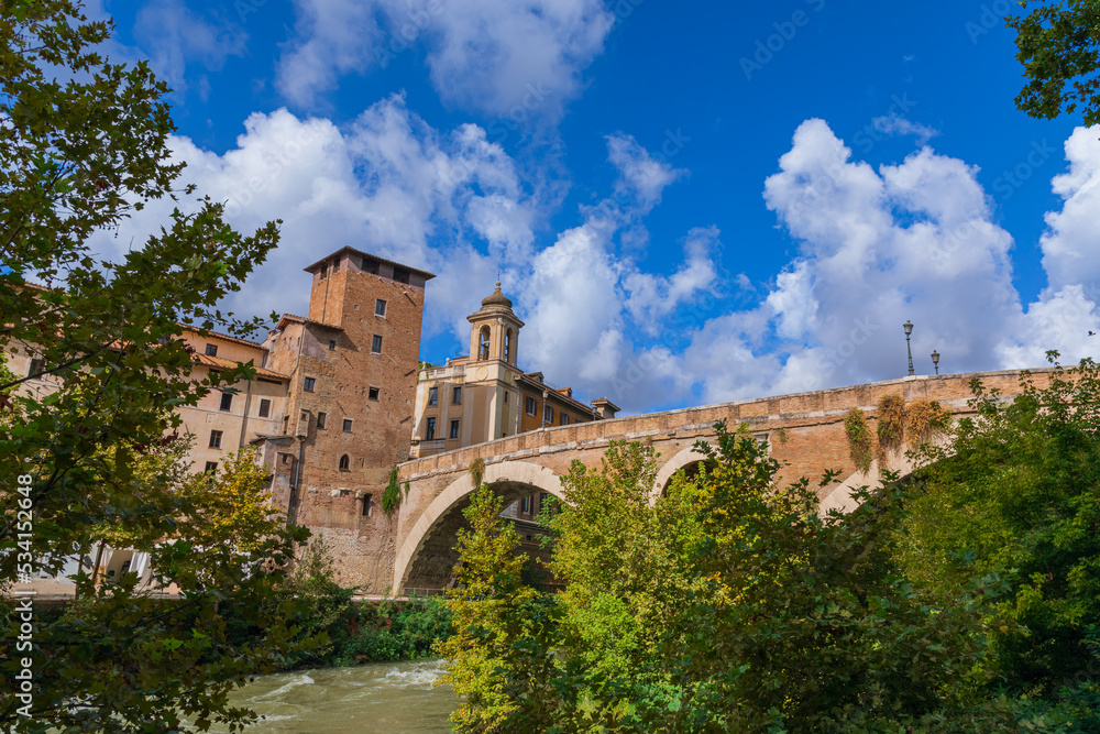 Tiber River in Rome, Italy: view of Tiber Island and Fabricium Bridge. Tiber River in Rome, Italy: view of Tiber Island and Fabricium Bridge.