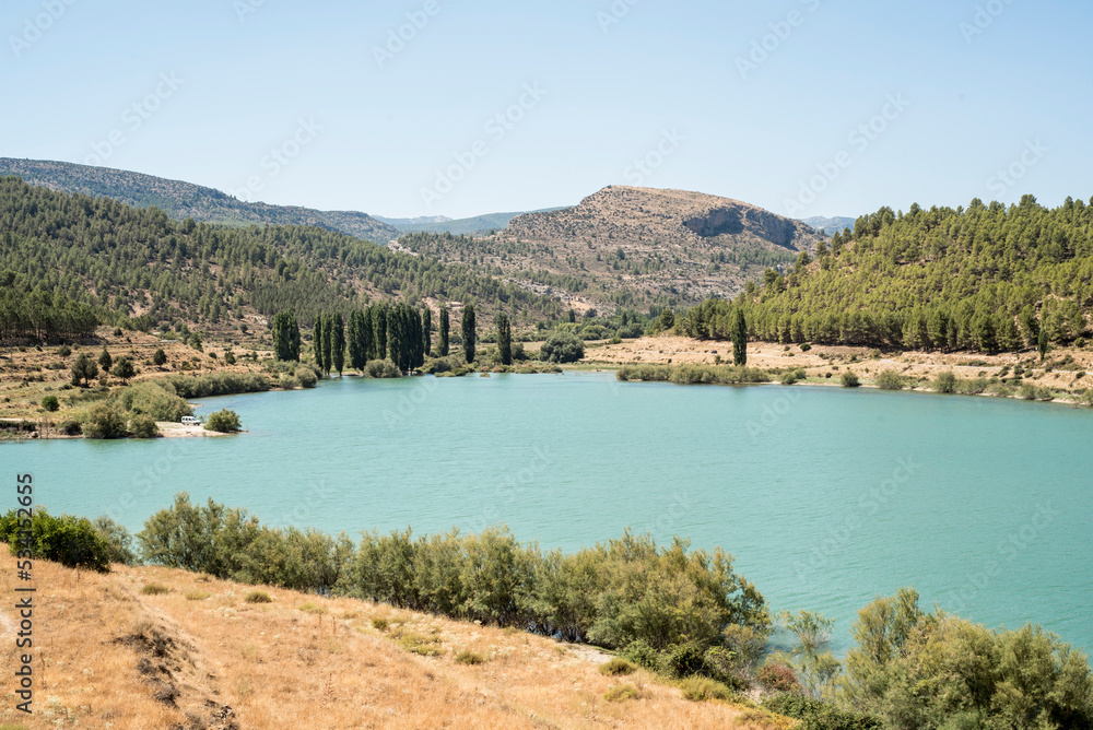 Taibilla reservoir full of water in summer