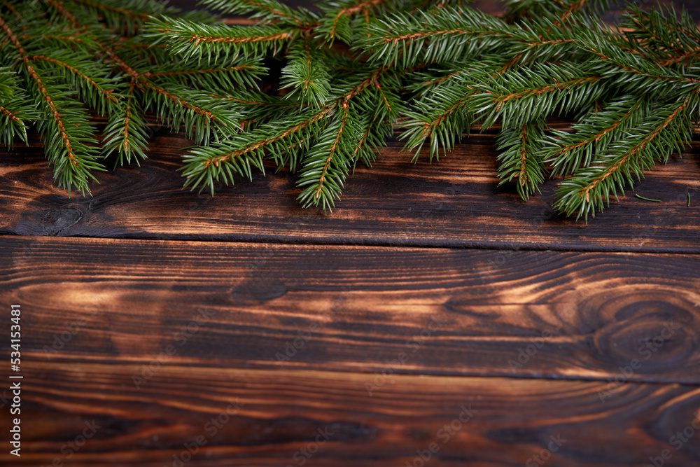 Christmas tree branches on the wooden background Christmas tree branches on the wooden background