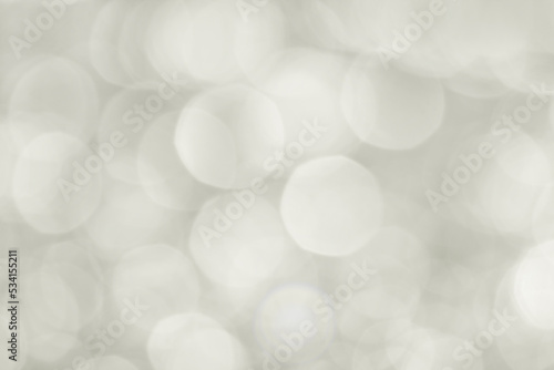 Abstract background grey bokeh lights.
