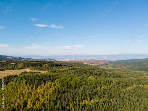 Aerial landscape with green mountains and blue sky