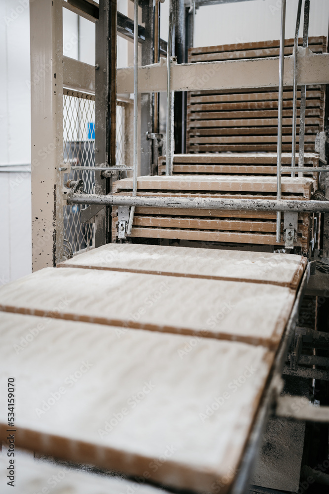 Huge factory line for sweet food and cookies production. Close up shots of industrial manufacturing process. Huge factory line for sweet food and cookies production. Close up shots of industrial manufacturing process.