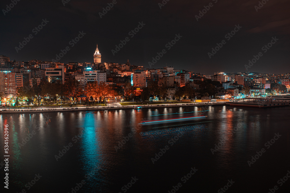 Galata tower and Cityscape view at night of Istanbul city and Bosphorus strait 