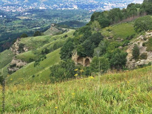 Panoramic views from Bolshoye Sedlo mountain to the Kislovodsk National Park and the city of Kislovodsk, North Caucasus, Russia. photo