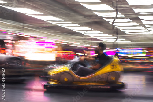 Abstract photo of bumper cars at amusement park of izmir fun fair.