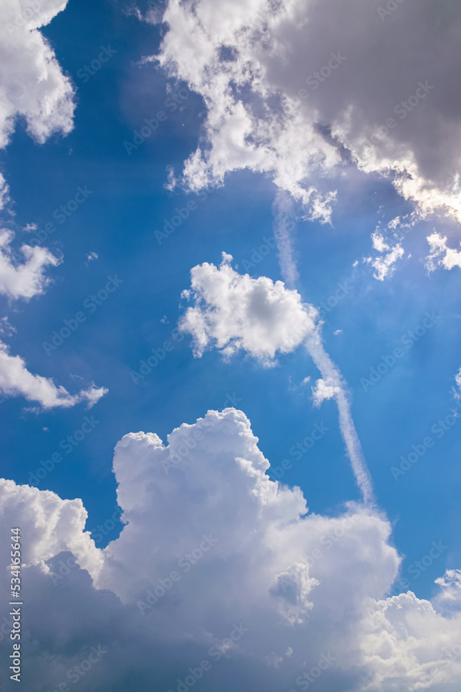 Engine exhaust contrails in the blue cloudy sky. Engine exhaust contrails in the blue cloudy sky.