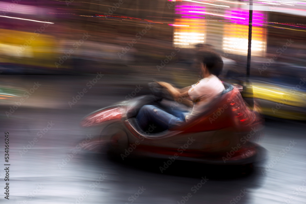 Abstract photo of bumper cars at amusement park of izmir fun fair.