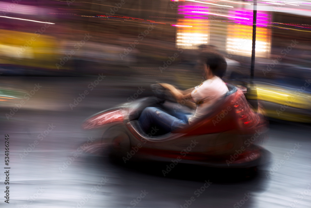 Fototapeta premium Abstract photo of bumper cars at amusement park of izmir fun fair.