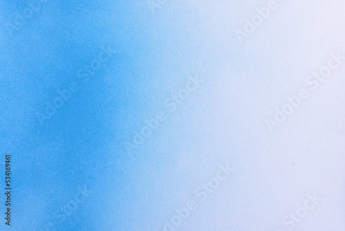 gradient blue spray paint on a white paper background