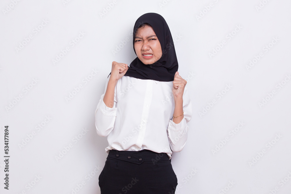 portrait of stressed sick asian muslim woman with headache on white background
portrait of stressed sick asian muslim woman with headache on white background
