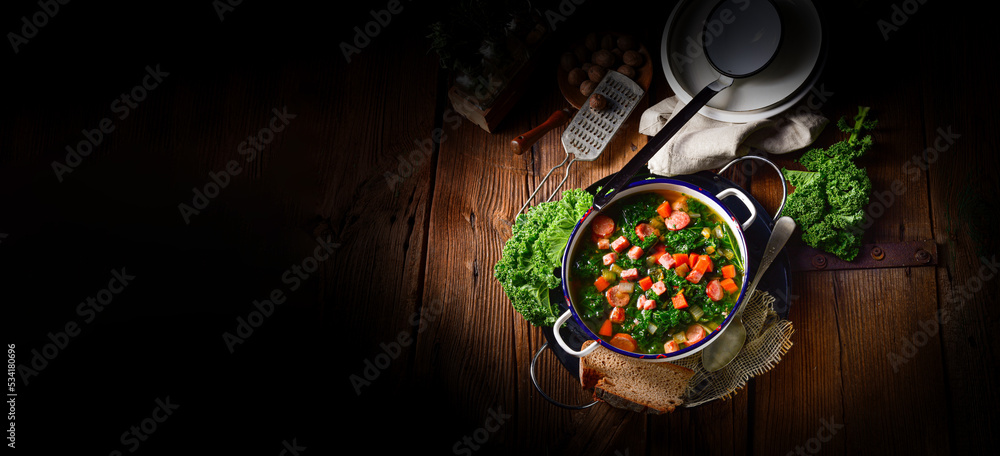 autumnal kale soup with sausage and bacon cubes