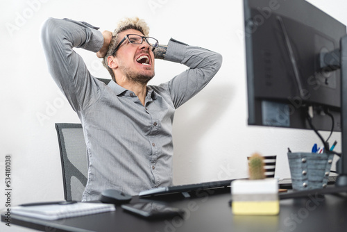 Fotografie Businessman stressed out and screaming at the office