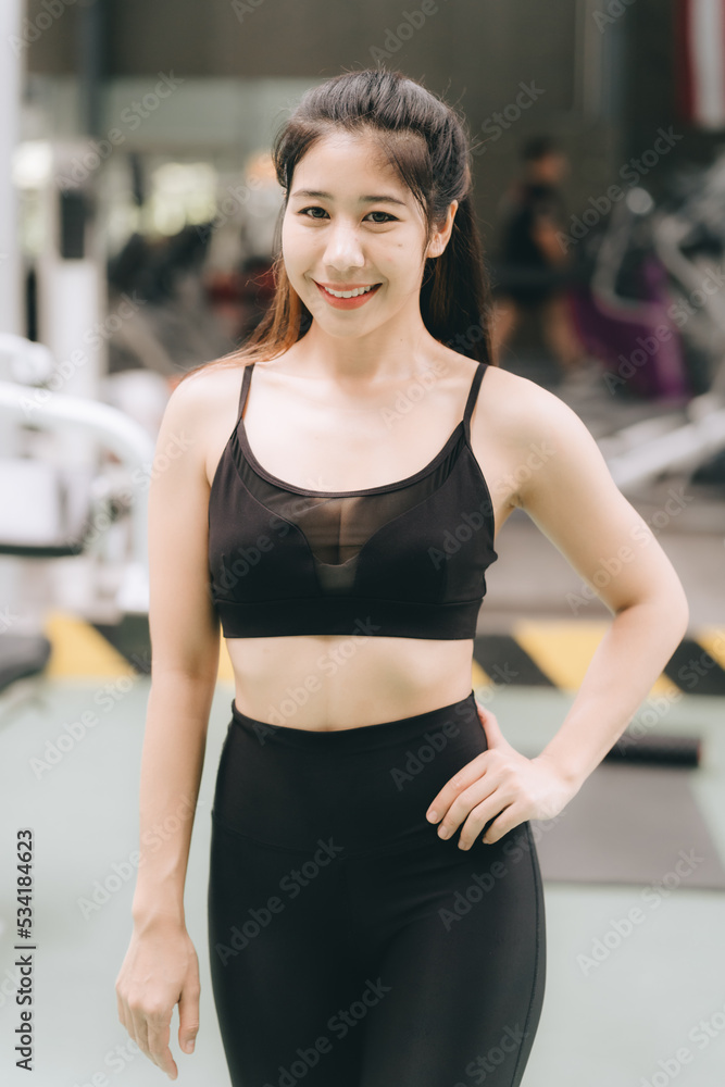 Asian female fitness athlete in gym Asian female fitness athlete in gym