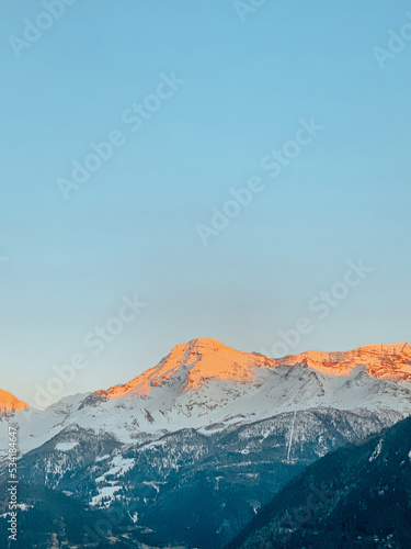 snowy mountains in the winter with a blue sky the alps ski snowboard un sunset 