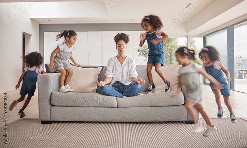 Meditation, yoga mom and children running, energy and hyperactive with adhd with mother doing stress free exercise on sofa in brazil home. Playing, distracted and energetic kids with zen woman photo