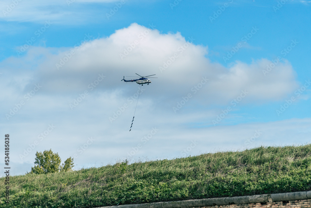 Military helikopter mi-17 carrying soldiers on a rope during an international military exercise Military helikopter mi-17 carrying soldiers on a rope during an international military exercise