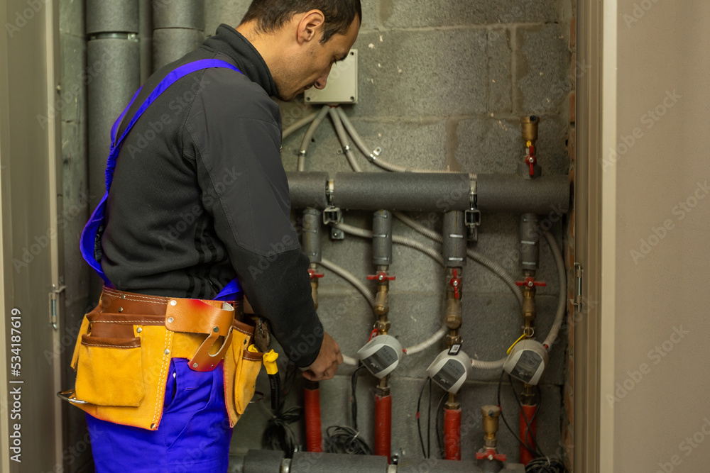 Fototapeta premium Handsome young man builder installing