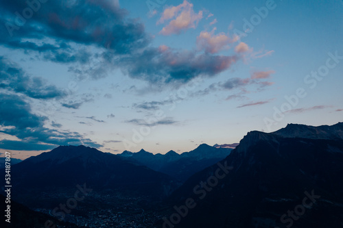 Swiss mountains forest in switserland sun sunset clouds hiking in a landscape blue hour night