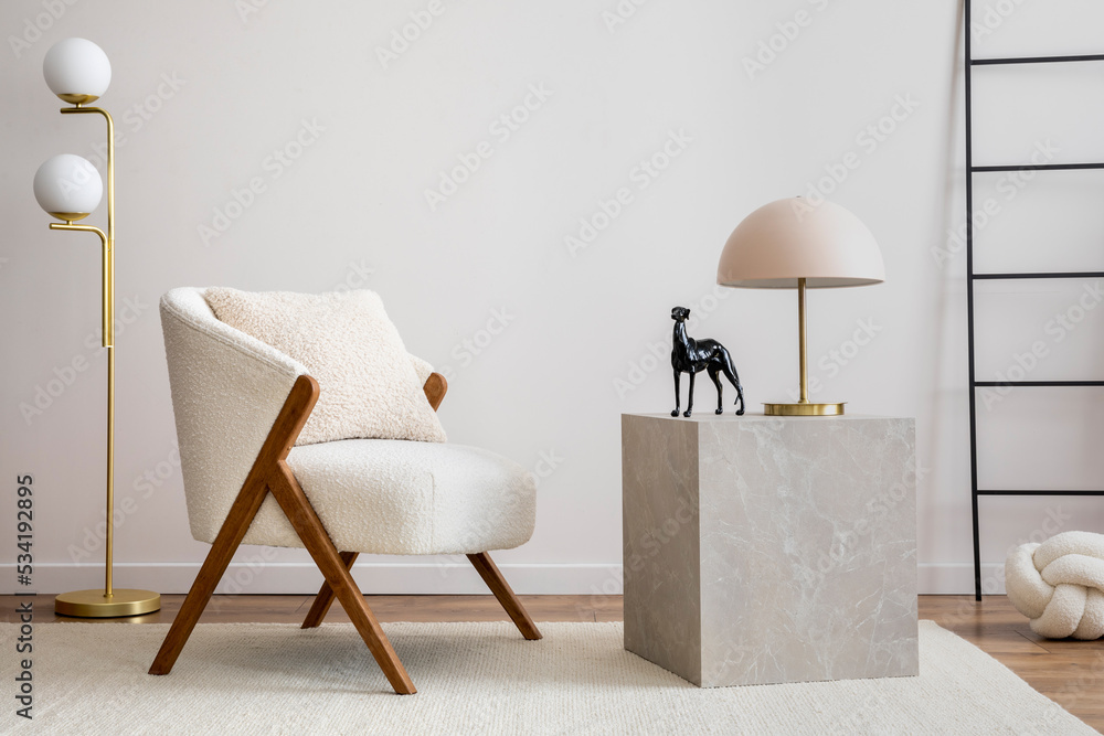 Interior design of harmonized living room with white boucle armchair,  marble cube, gold lamp, ladder, decoration and personal accessories.  Minimalist home decor. Copy space. Template. Stock Photo | Adobe Stock