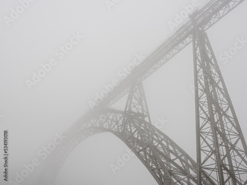 Old iron bridge in the morning mist