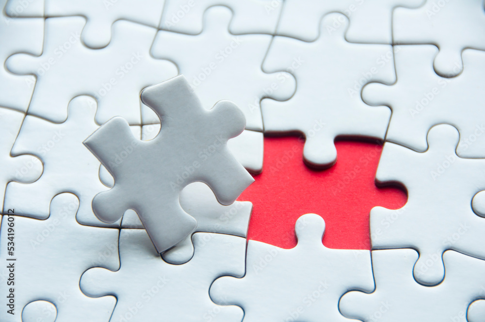 White jigsaw puzzle with customizable space for text or idea. Copy space. White jigsaw puzzle with customizable space for text or idea. Copy space.