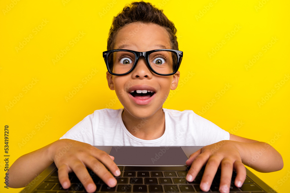 Photo of funny funky clever boy online study learner wear glasses look web  camera netbook interesting lesson isolated on yellow background Stock Photo  | Adobe Stock