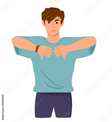 Annoyed and unhappy man showing his negative attitude with thumb down gesture. Dislike, disagree, disappointment, disapprove, no deal concept. Emotion and body language concept