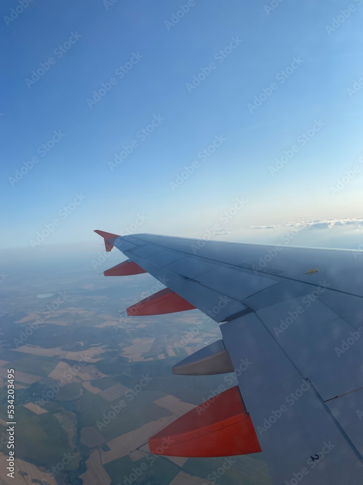 Wing of airplane with beautiful sky and view Wing of airplane with beautiful sky and view