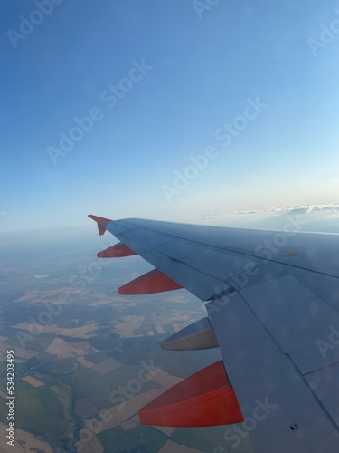 Wing of airplane with beautiful sky and view