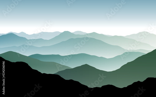 Fotografia Vector panoramic landscape with blue and green misty silhouettes of mountains an