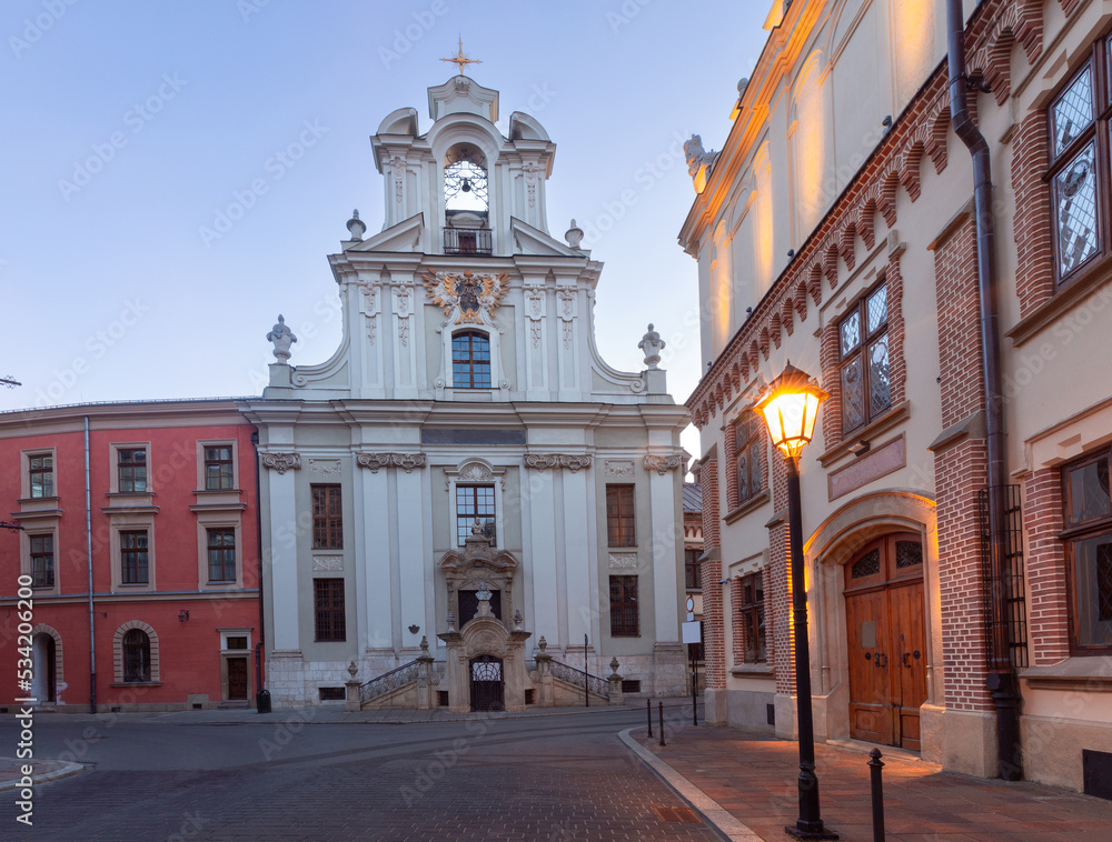 Fototapeta premium Krakow. Old houses in night illumination at dawn.