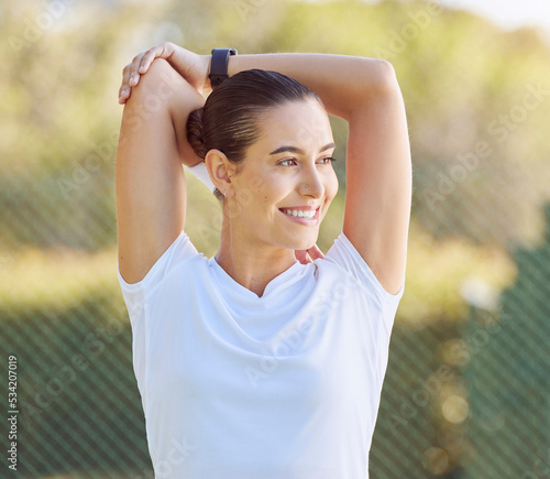 Health, sport and stretching woman before run, happy and smile while exercise warm up in a morning at a park. Fitness, energy and training by healthy female relax and stretch, prepare body for cardio photo