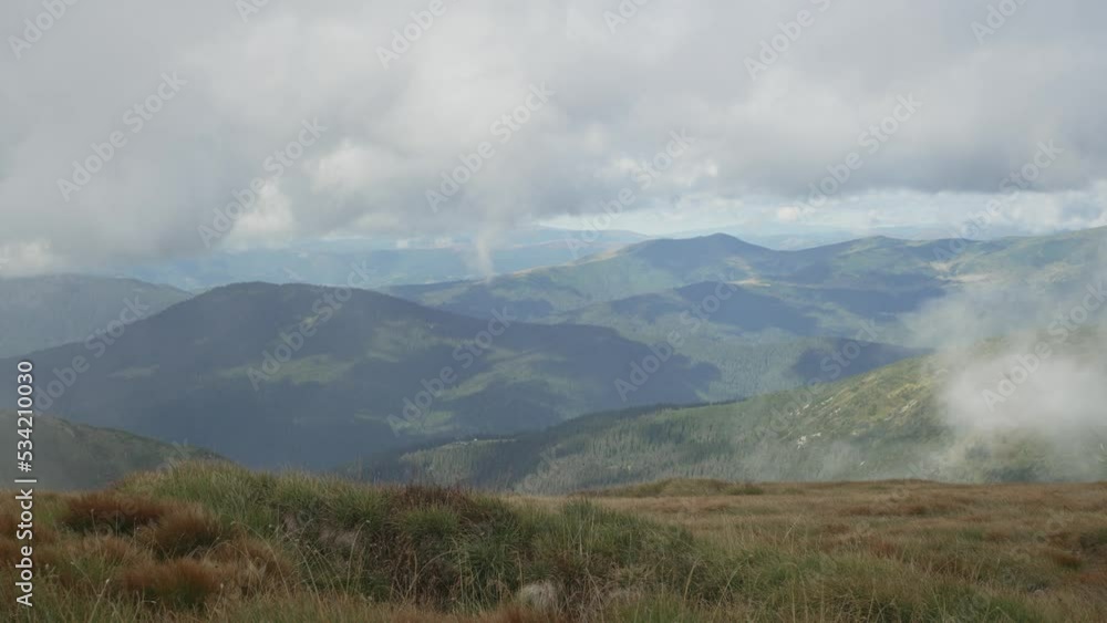 Beautiful background landscape nature mountains. Mountain ranges and peaks are covered with clouds. High quality 4k footage Beautiful background landscape nature mountains. Mountain ranges and peaks are covered with clouds. High quality 4k footage