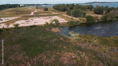 The remaining concrete surfaces, now overgrown, at the Sappi Plant. photo