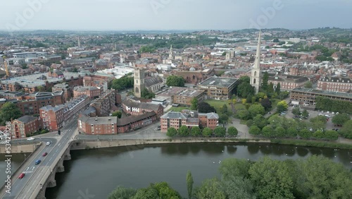 Aerial View of Downtown Worcester, England UK, River Severn, Central Historic Buildings and Glover's Needle Tower. Dolly Drone Shot photo