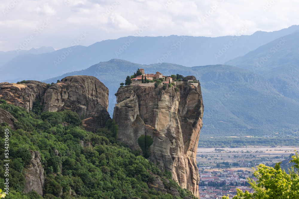 Kalabaka town is situated at the foot of the Meteora peaks and Saint Stephen Nunnery flies at half a kilometer height. Religious destination and spiritual search. Greece