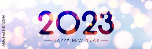 Banner with 2023 happy new year sign on sweaty grass.
