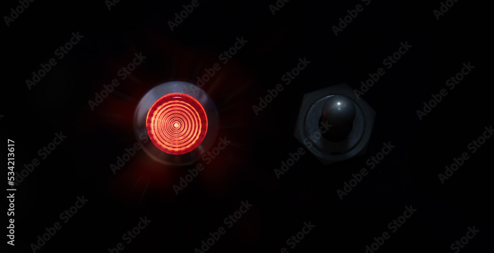 Switched ON. Red indicator or ON lamp with a toggle switch next to it