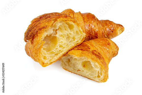 Cut croissant isolated on white background.