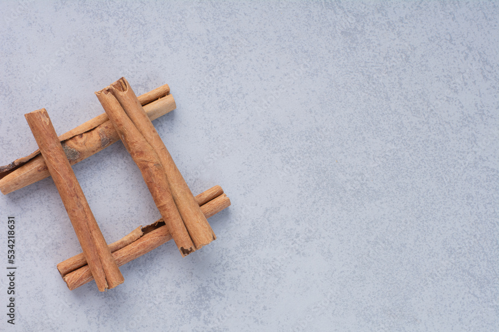 Cinnamon sticks isolated on concrete background Cinnamon sticks isolated on concrete background