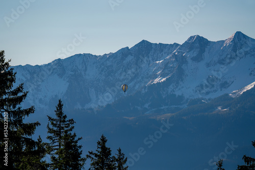 hot air balloon on the sunny morning in the mountains