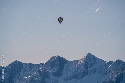 hot air balloon on the sunny morning in the mountains